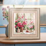 Kit de punto de cruz Magic Needle 70-34 Morning in Rosy Tones, flores rosas junto a la ventana