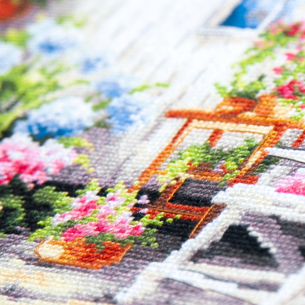 Kit de punto de cruz Magic Needle 70-47 Quiet Happiness, jardín con flores y casa