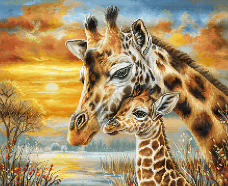Kit de punto de cruz Luca-S GOLD BU5109 Giraffe Cuddle con dos jirafas abrazadas en un paisaje cálido de tonos dorados.