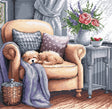 Kit de punto de cruz AVA Stitch P053 Sweet Dreams con perro pequeño dormido en un sofá beige, manta, cojines y flores en una escena acogedora de interior.