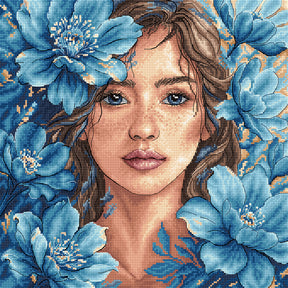 Kit de punto de cruz AVA P125 Mirada Azul con un retrato artístico de intensos ojos azules, bordado sobre tela Zweigart Aida 16 ct con hilos DMC y Luca-S.