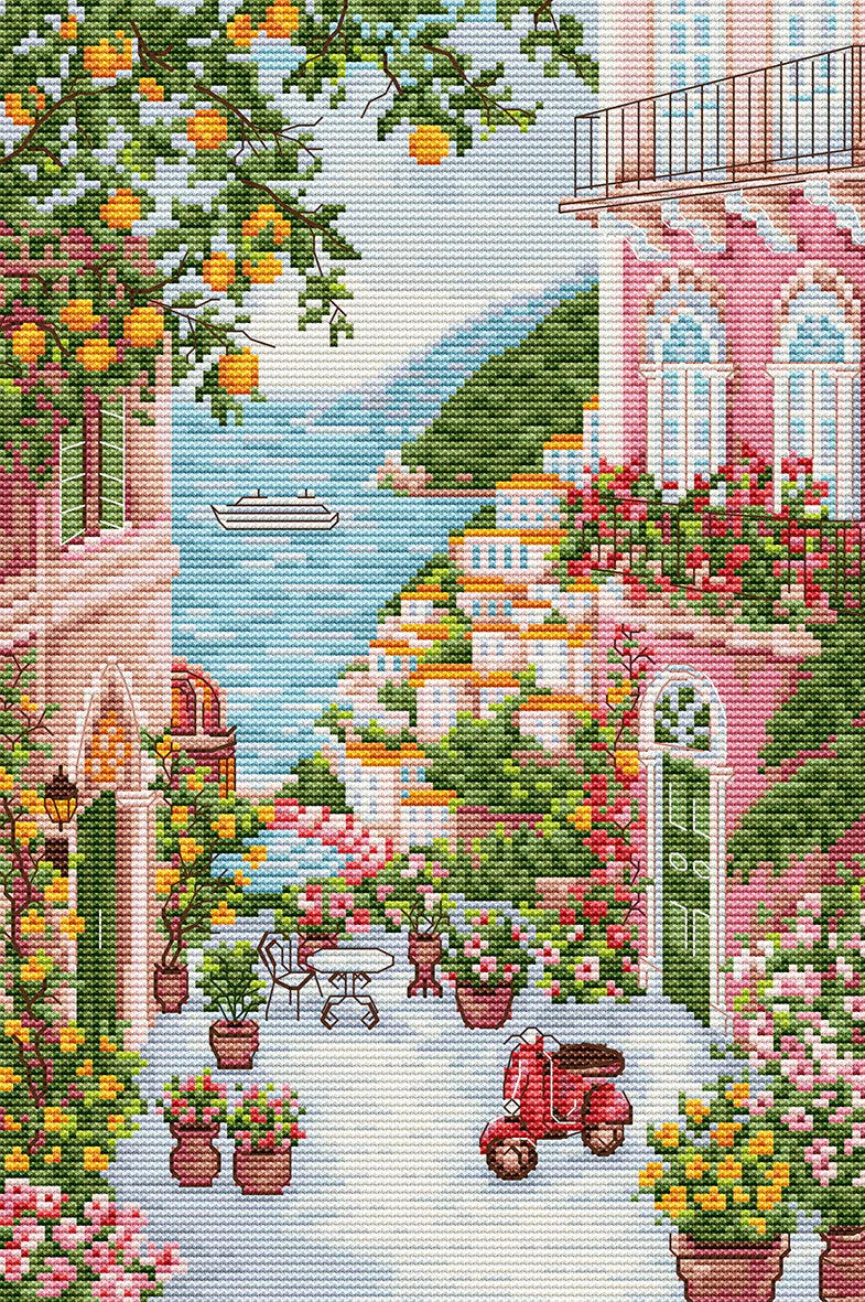 Paisaje de Positano con casas, flores y vistas al mar bordado en punto de cruz estilo mediterráneo