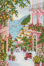Paisaje de Positano con casas, flores y vistas al mar bordado en punto de cruz estilo mediterráneo